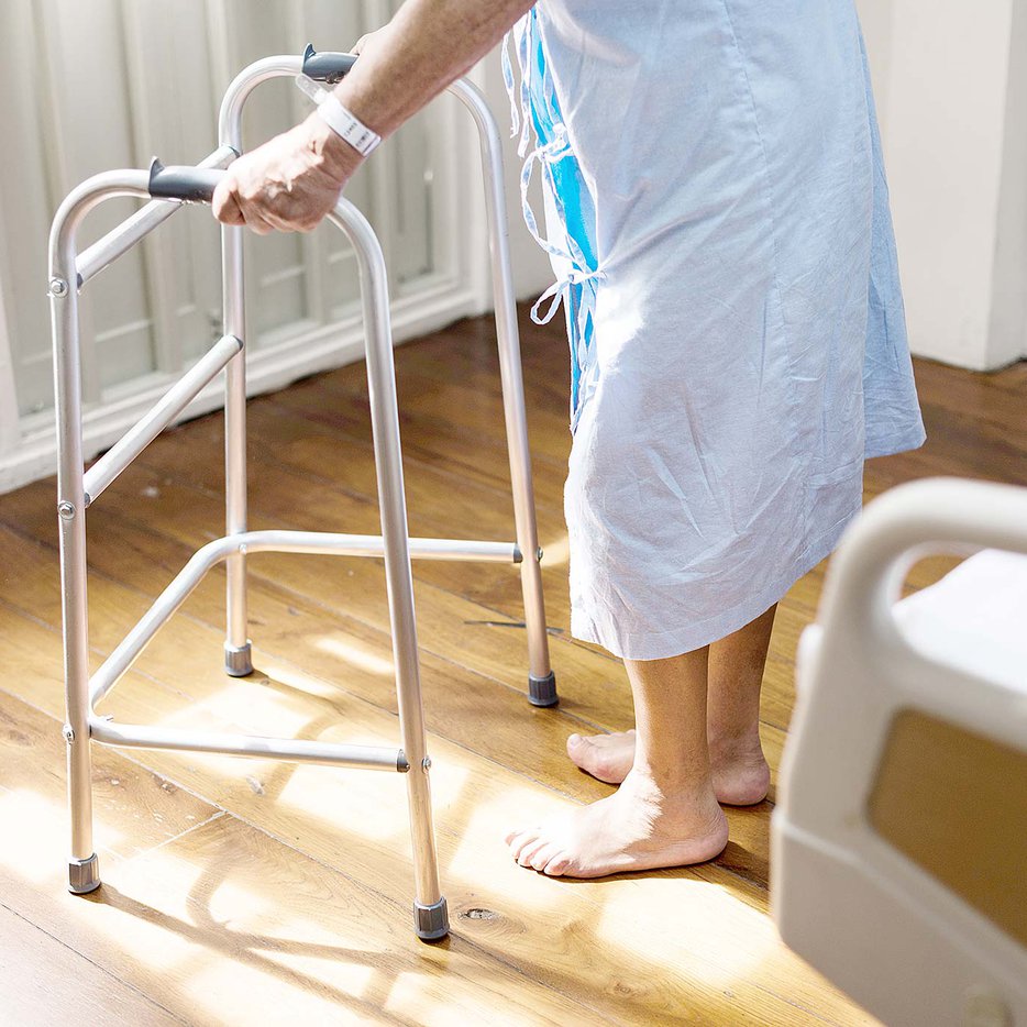 Elderly patient in hospital gown